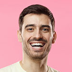 Young-European-man-in-a-T-shirt-smiles-joyfully-and-shows-thumbs-up1.jpg